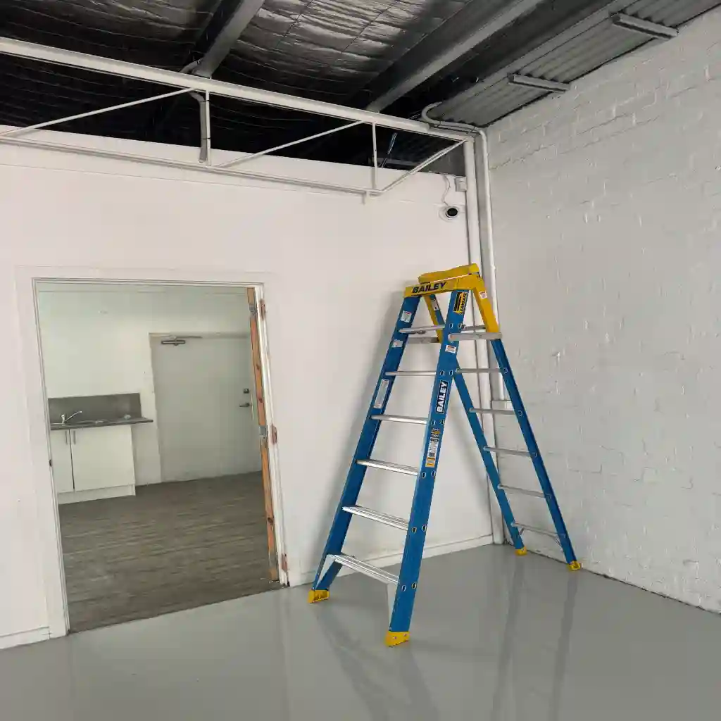 Dome camera being installed inside a Melbourne commercial space