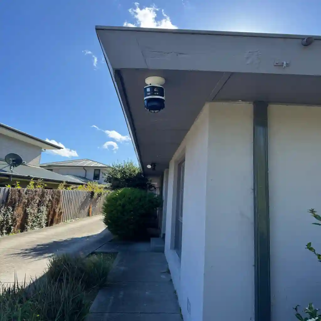 Dual lens camera fitted at an eave covering a long approach