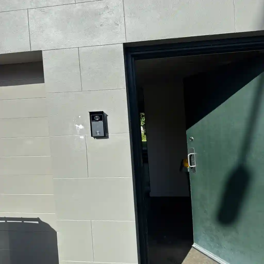 Video intercom door station fitted beside a common entry in a Melbourne apartment building