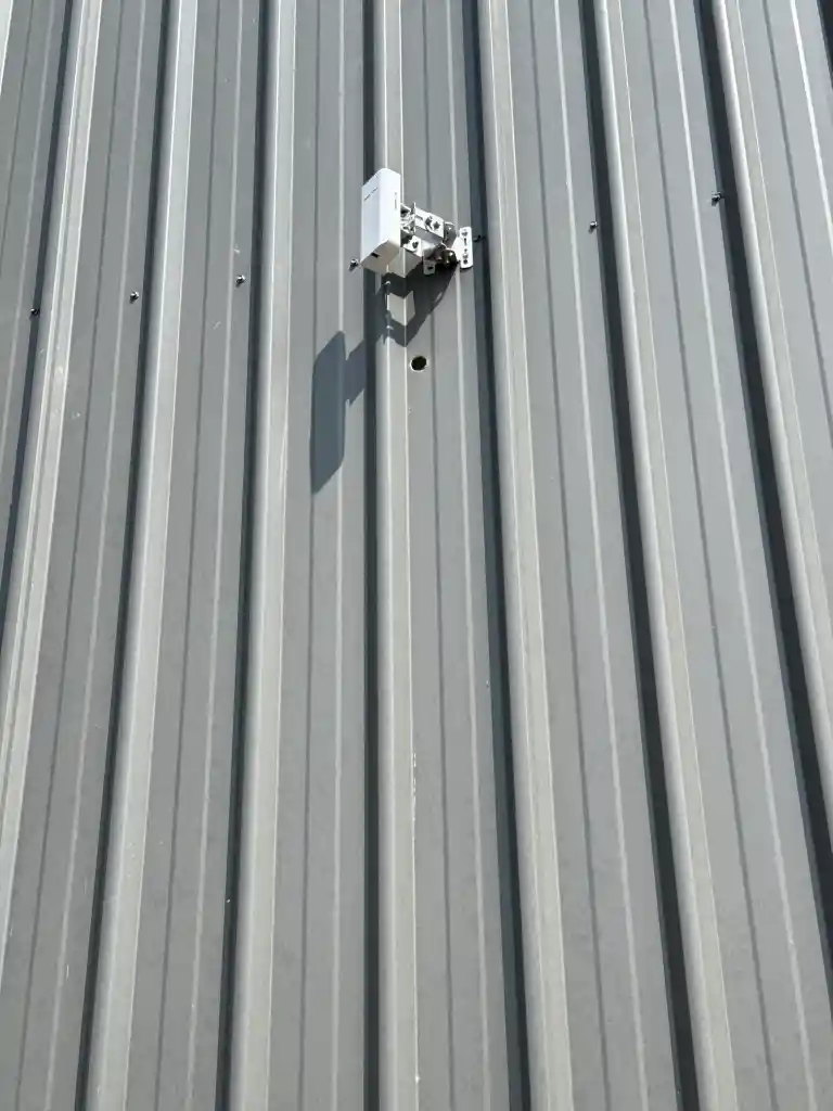 Weather rated wireless unit mounted on a clad outbuilding in Victoria