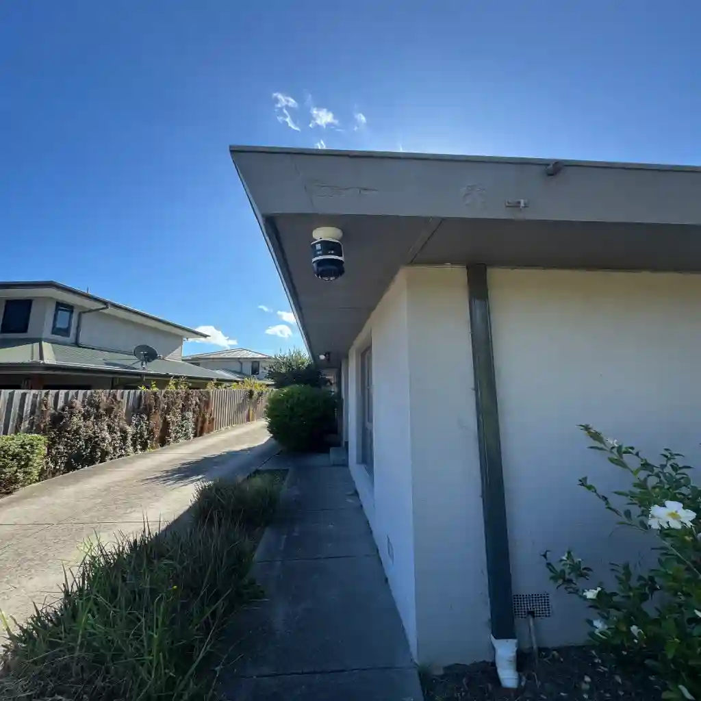 Camera framed along a shared driveway in Reservoir