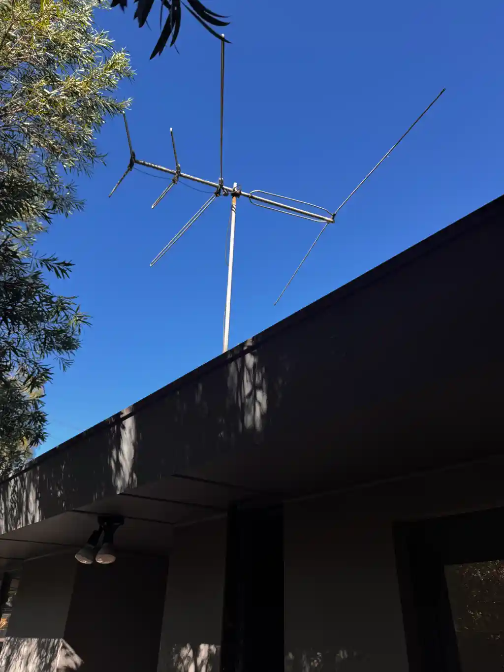Mast raised to clear tall timber on a forest edge block at Yarra Junction