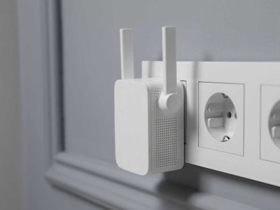 Plug-in mobile phone signal booster device installed in a Melbourne residential wall socket. Borderless Solutions specializes in mobile signal booster installation across Melbourne, enhancing coverage and signal strength in homes and businesses.