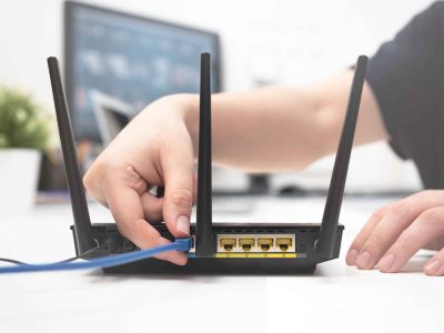 Technician reconnecting and relocating an NBN modem/router during a service appointment in Melbourne. Borderless Solutions offers expert NBN relocation and setup services for homes and businesses across Melbourne.