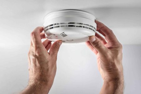 A security technician installs a smoke and security alarm system in Melbourne. Borderless Solutions provides expert installation of smoke detectors, motion alarms, and integrated security systems for homes and businesses. Protect what matters most with trusted service across Melbourne. Visit borderlesssolutions.net.au or call 1300 520 116.