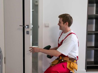 access-control-installation-melton Professional technician installing an access control system and smart door lock in Melton. Borderless Solutions provides expert security services including CCTV installation, alarm systems, access control, and smart home automation.